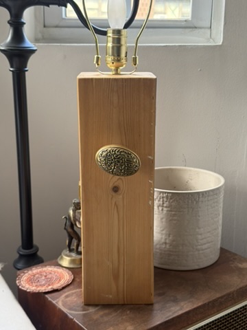 Ellie’s wooden wine-box lamp with ornate brass doorknob